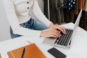 Female Temporary Employee Working on Laptop