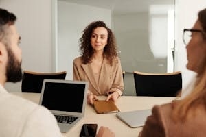 Woman in A Temporary Employment Job Interview with Two HR