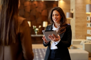 Female Concierge Staff Helping A Customer