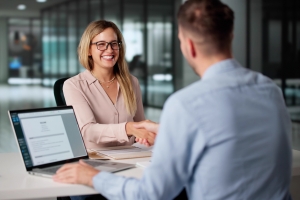 HR Consultant Shaking Hand with Emergency Employee in Interview
