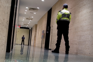 After Hours Security Guards Patrolling Inside Commercial Building