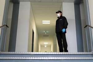 Security Guard Wearing Mask and Gloves on Duty