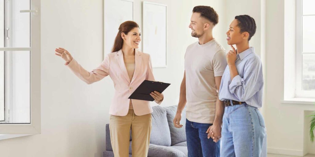 Female Apartment Leasing Support Showing House to A Couple