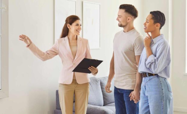 Female Apartment Leasing Support Showing House to A Couple