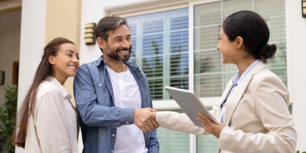 Female Property Manager Shaking Hand with Tenant After Finding Them Property for Rent