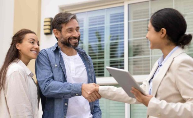 Female Property Manager Shaking Hand with Tenant After Finding Them Property for Rent