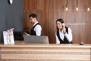 Concierge Staff Working on Front Desk in Modern Lobby of A Building
