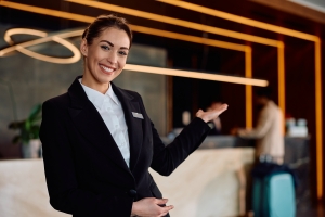 Happy Concierge Welcoming Guests in Hotel Property