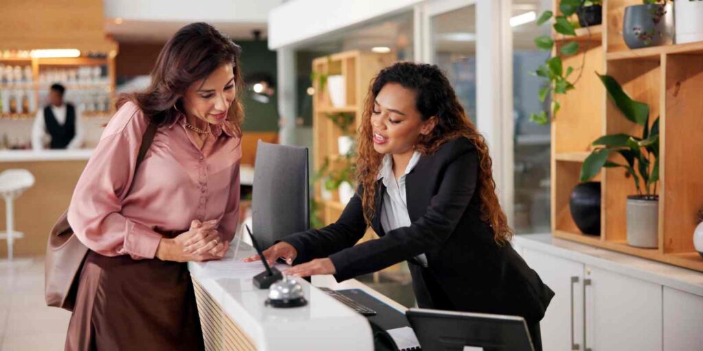 High-Touch Resident Concierge Helping Guest at Her Desk