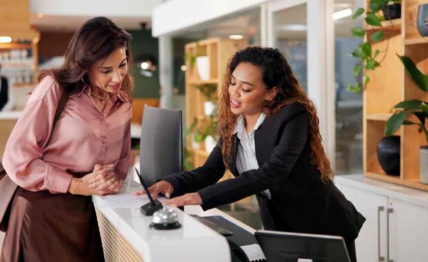 High-Touch Resident Concierge Helping Guest at Her Desk