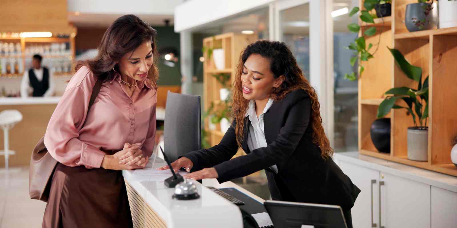 High-Touch Resident Concierge Helping Guest at Her Desk
