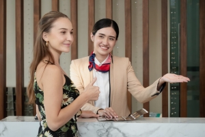 Beautiful Young Female Guest Pleased with Apartment Concierge Service