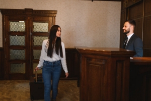 Female Resident Asking about Relocation Support to Concierge