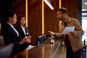 Professional Concierge Talking to an Angry Guest Calmly