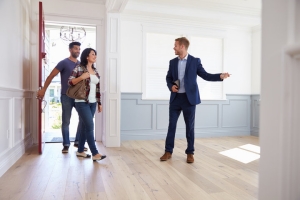 Fractional Property Management Staff Showing House to Couple